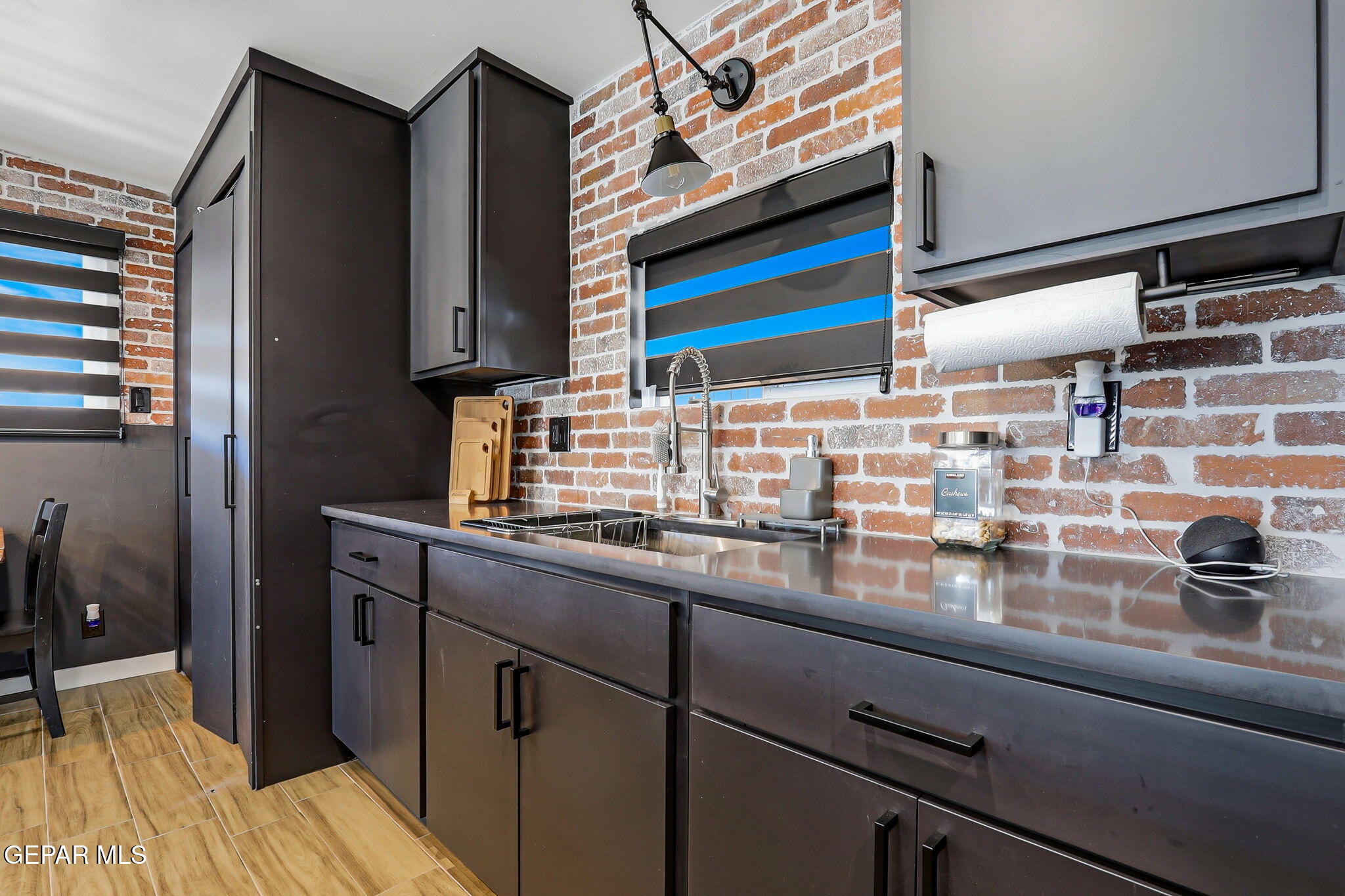 5240 Blue Ridge Drive El Paso, TX 79904 - Photo 12 of 37 a kitchen with a sink and cabinets