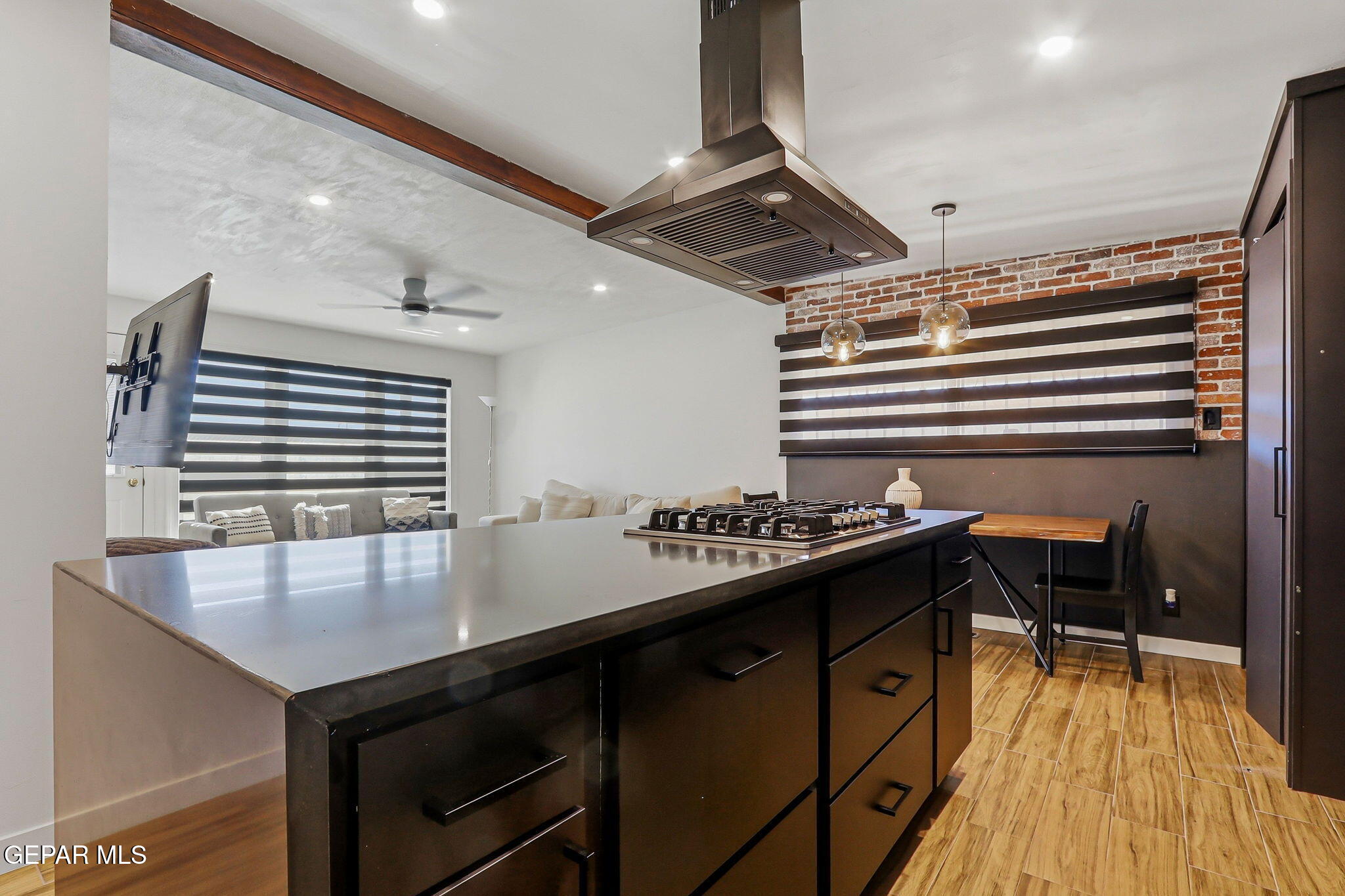 5240 Blue Ridge Drive El Paso, TX 79904 - Photo 13 of 37 a kitchen with a table chairs and wooden floor