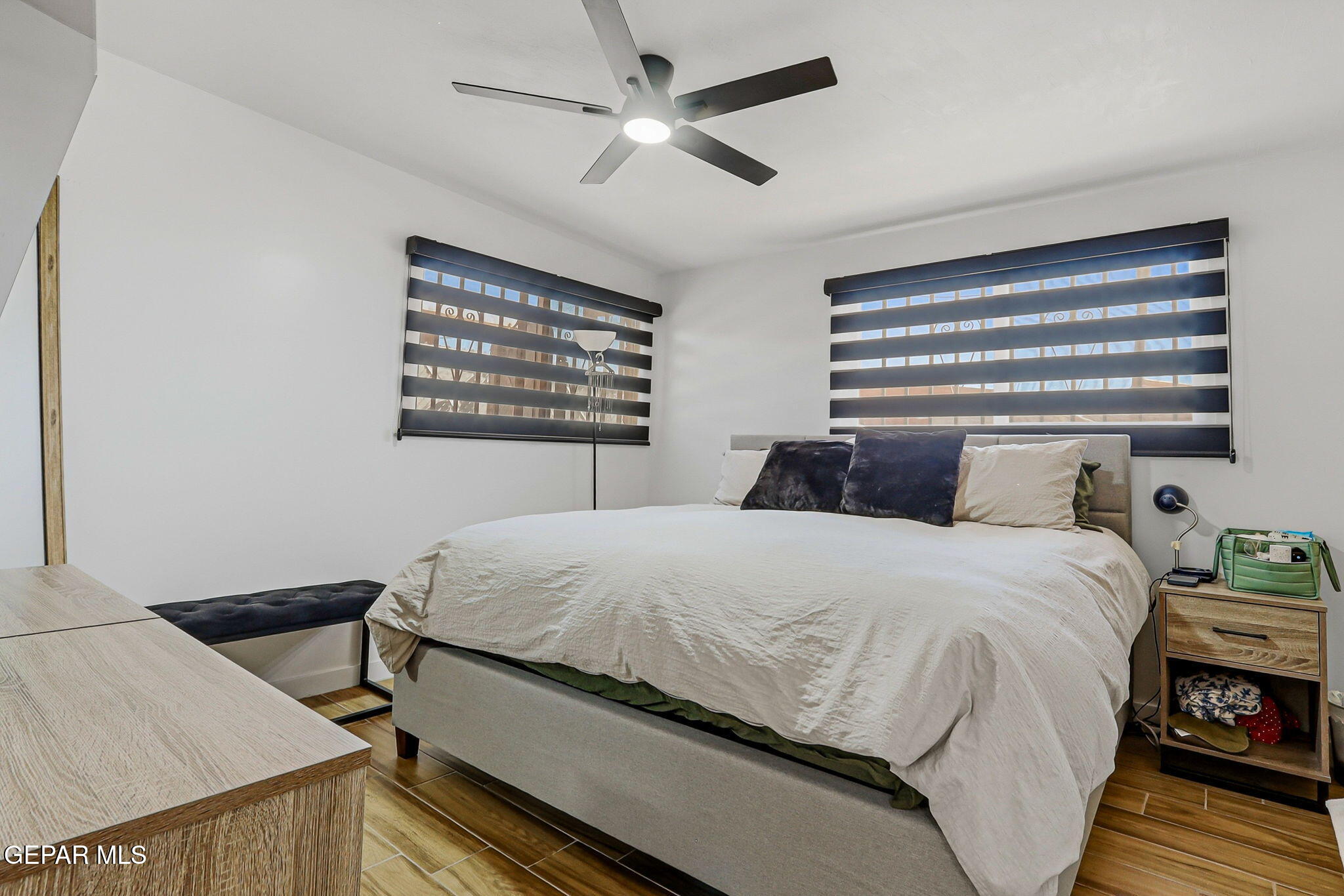 5240 Blue Ridge Drive El Paso, TX 79904 - Photo 21 of 37 a bedroom with a bed and wooden floor