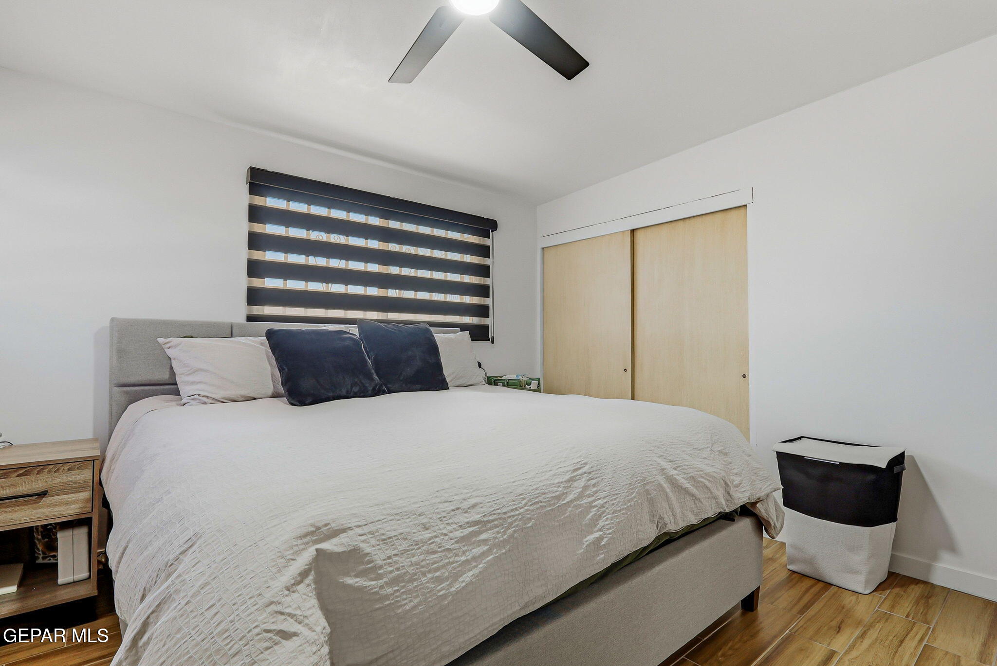 5240 Blue Ridge Drive El Paso, TX 79904 - Photo 23 of 37 a bedroom with a bed and wooden floor