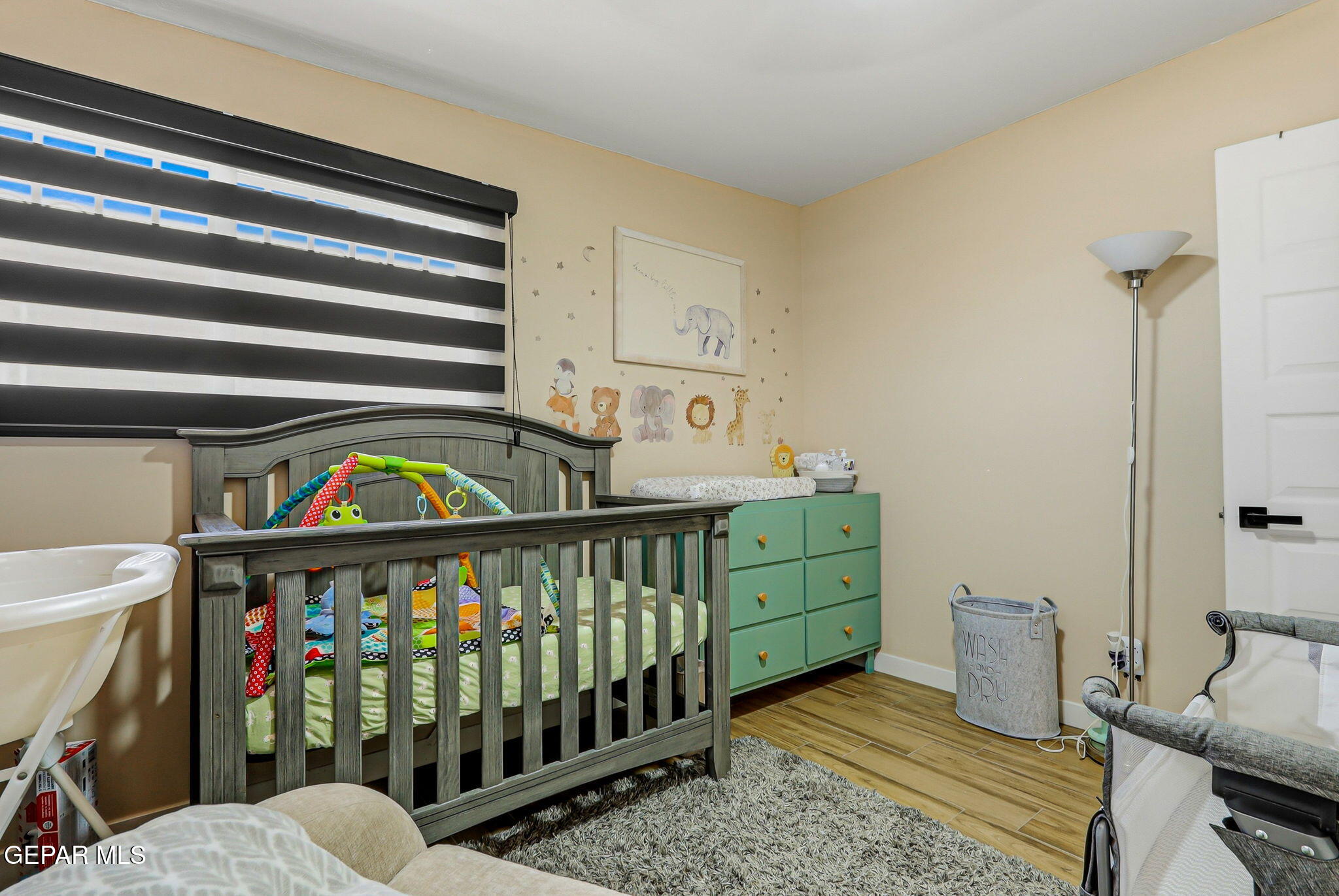 5240 Blue Ridge Drive El Paso, TX 79904 - Photo 26 of 37 a bedroom with furniture and a baby crib