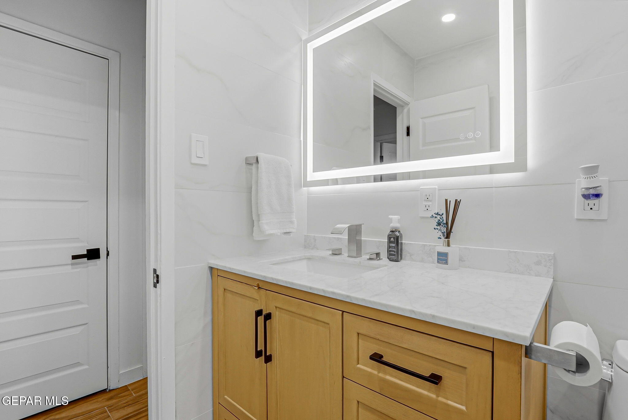 5240 Blue Ridge Drive El Paso, TX 79904 - Photo 28 of 37 a bathroom with a sink and a mirror