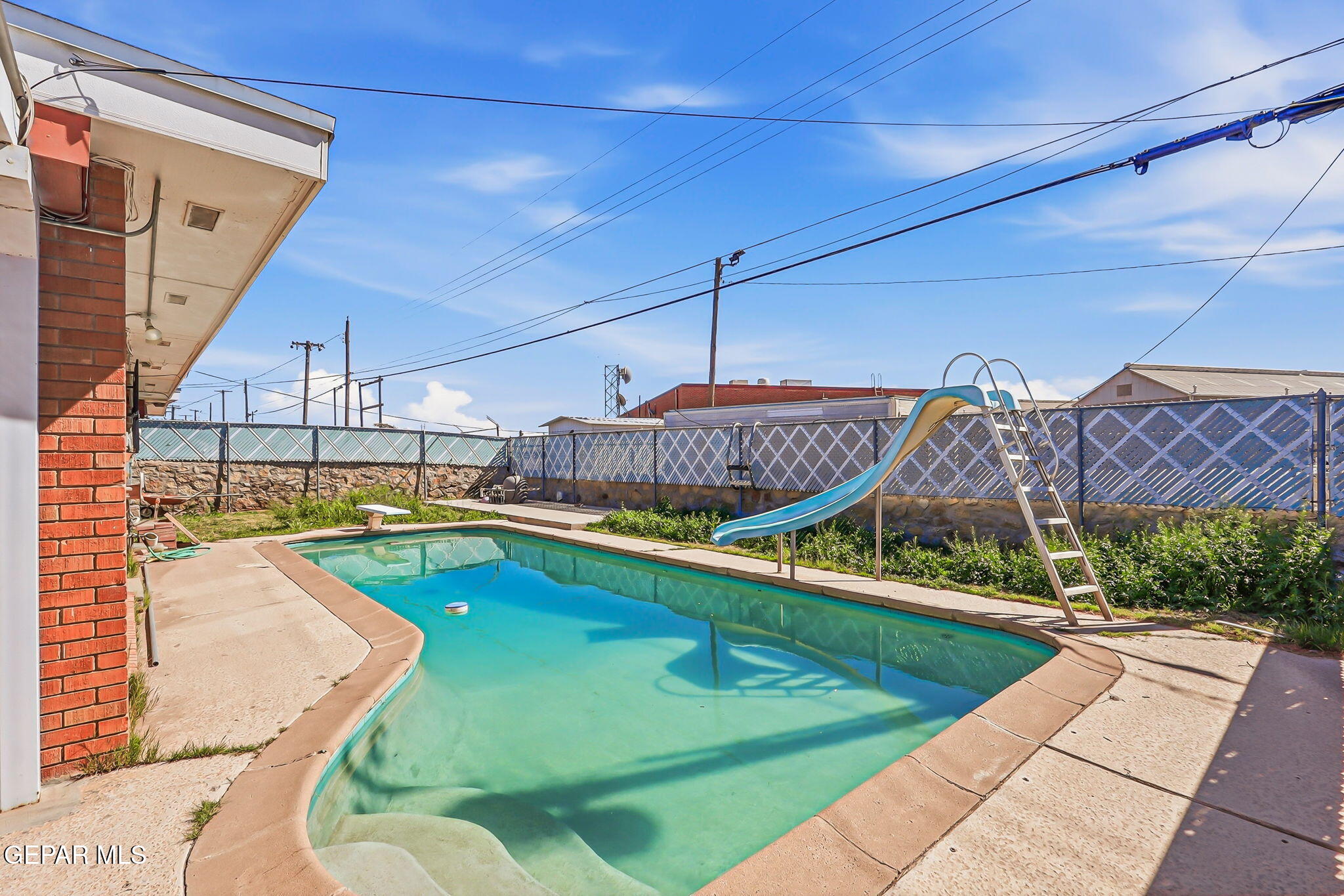 5240 Blue Ridge Drive El Paso, TX 79904 - Photo 32 of 37 a view of a swimming pool with a patio