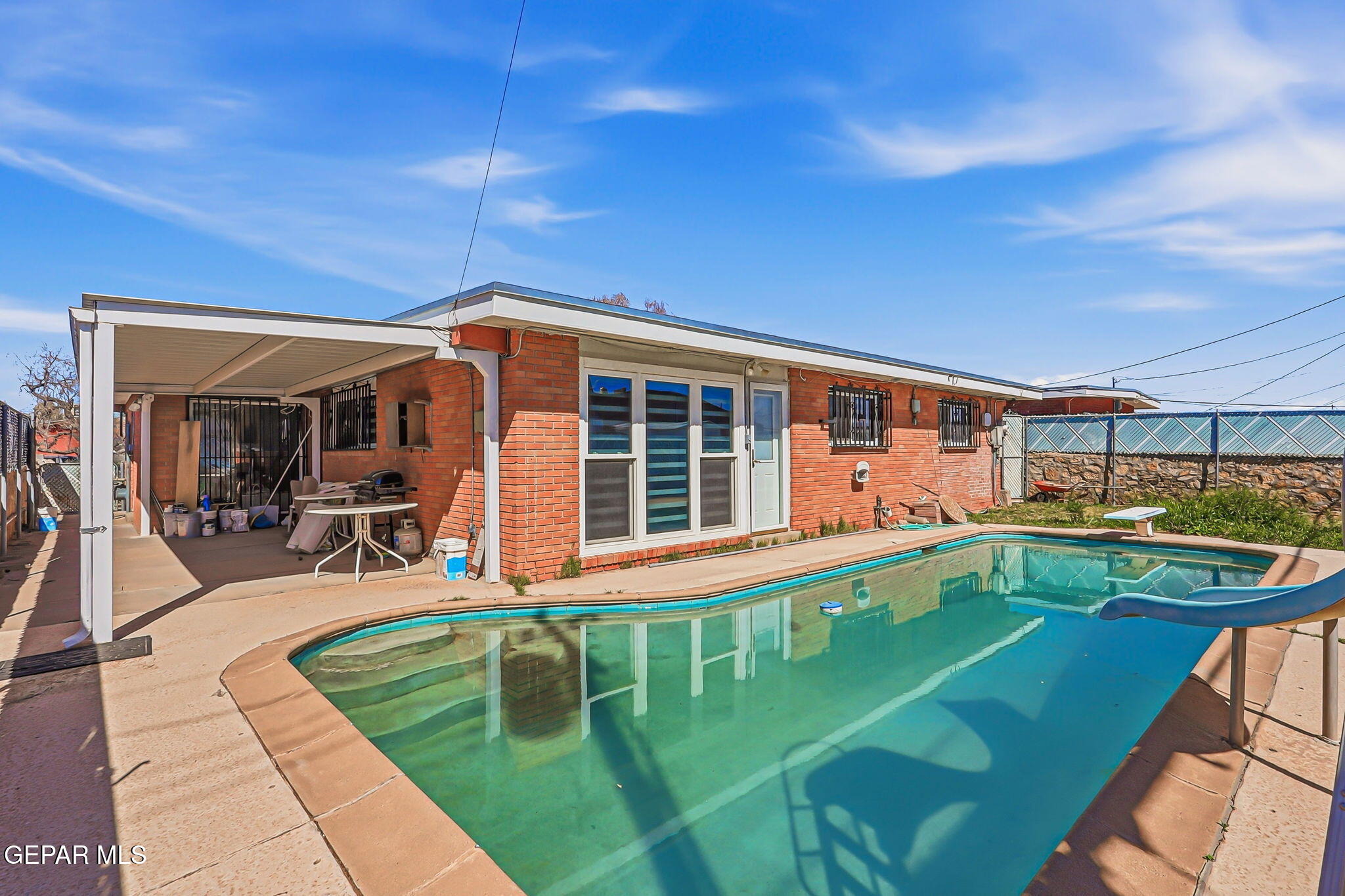 5240 Blue Ridge Drive El Paso, TX 79904 - Photo 33 of 37 a view of a patio with swimming pool table and chairs