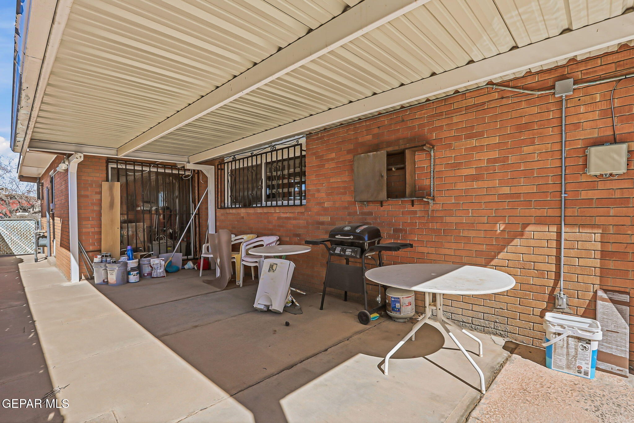 5240 Blue Ridge Drive El Paso, TX 79904 - Photo 34 of 37 a view of a patio with table and chairs and potted plants