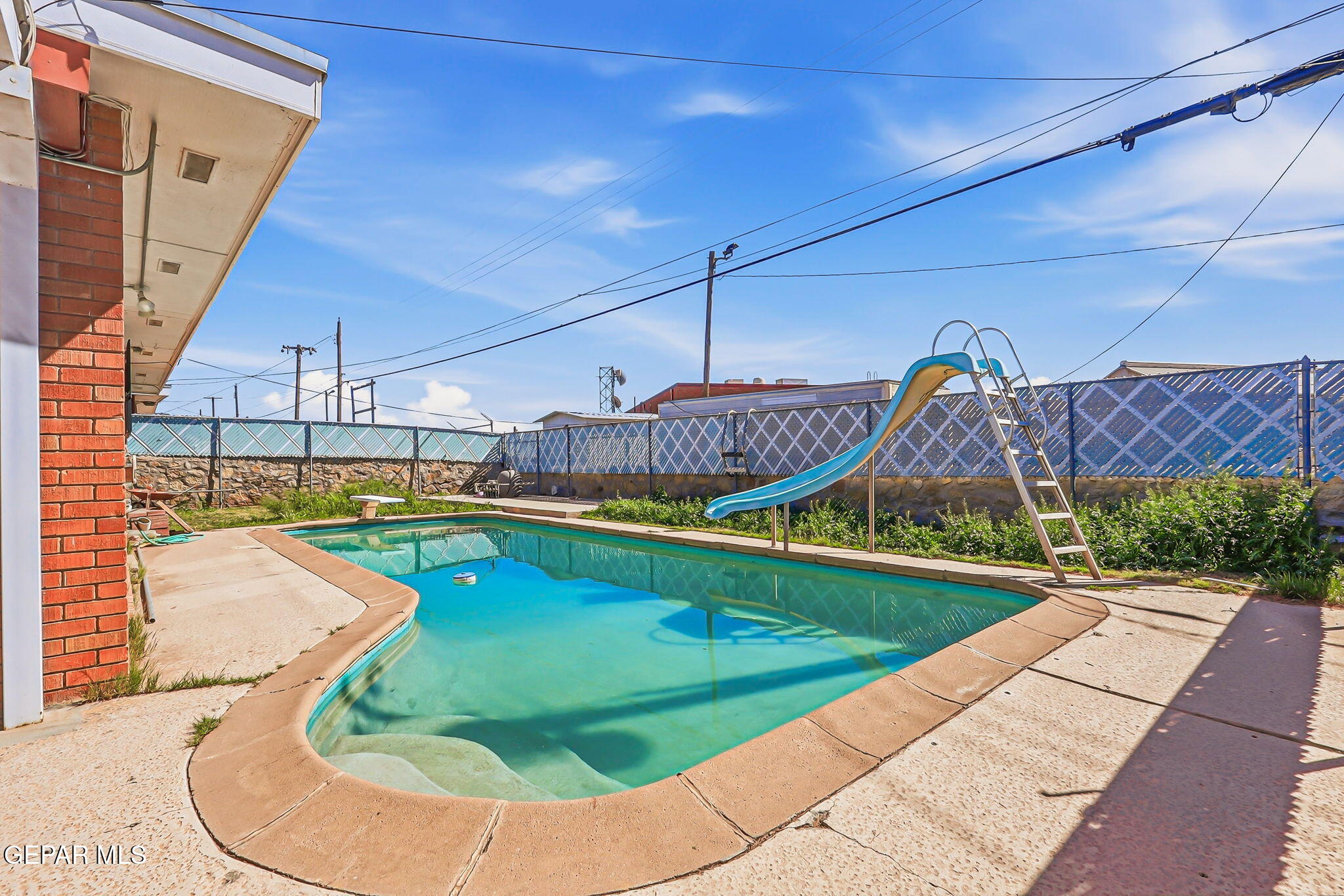 5240 Blue Ridge Drive El Paso, TX 79904 - Photo 7 of 37 a view of a swimming pool with a porch