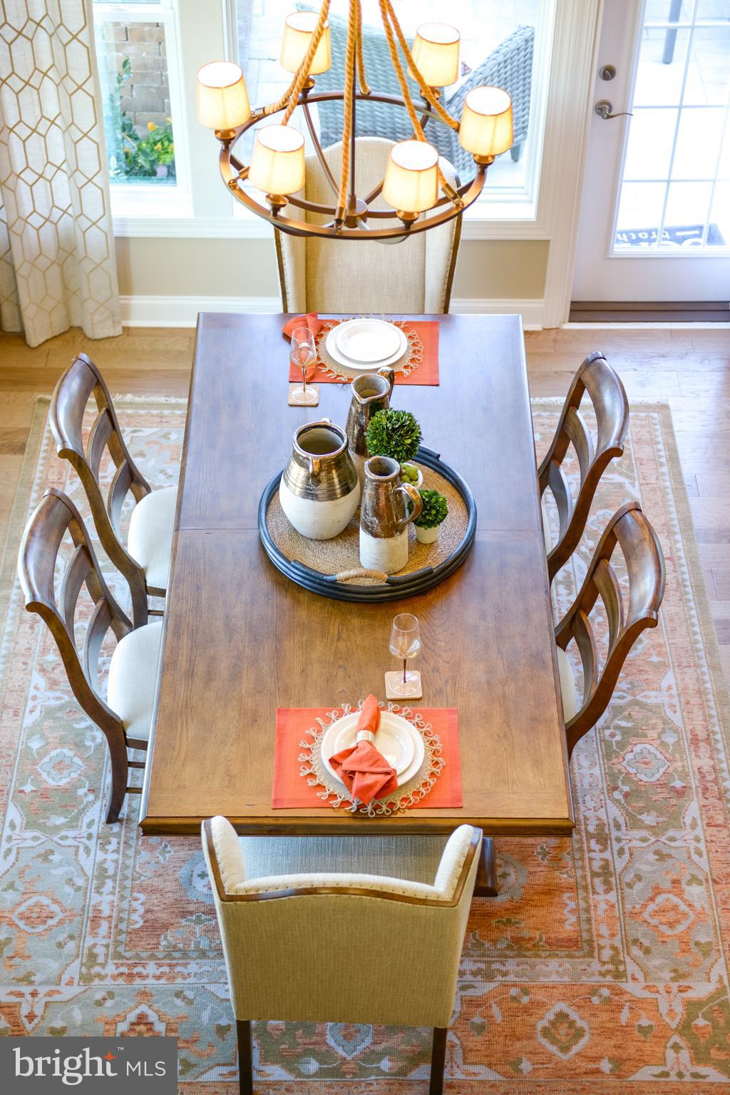 21802 Eastbridge Loop Lewes, DE 19958 - Photo 13 of 34 a view of a dining room with furniture and a rug