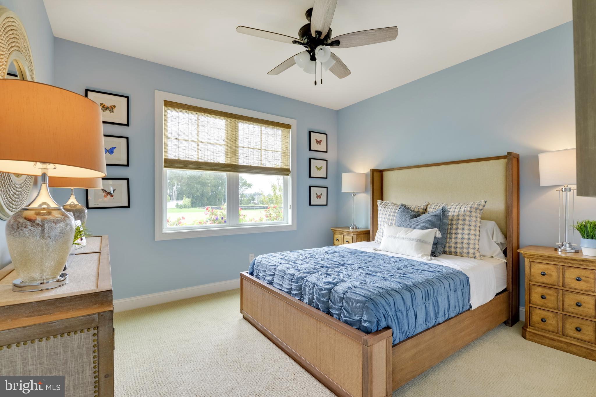 21802 Eastbridge Loop Lewes, DE 19958 - Photo 34 of 34 a bedroom with a large bed and a window