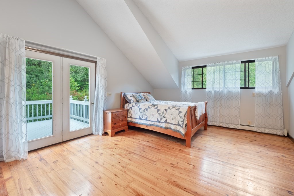 155 Worthington Road Huntington, MA 01050 - Photo 24 of 40 a bedroom with a bed and a large window