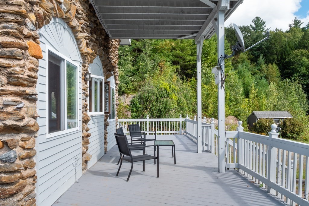 155 Worthington Road Huntington, MA 01050 - Photo 5 of 40 a view of a chair and table in the balcony