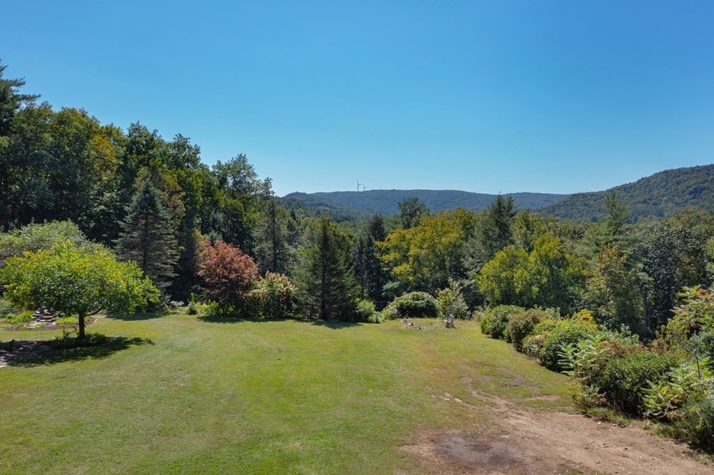 155 Worthington Road Huntington, MA 01050 - Photo 10 of 40 a view of a city with lush green forest