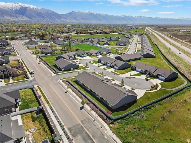 2028 West Grace Way Layton, UT 84041 - Photo 34 of 36 Aerial view of property and surrounding area featuring mountains and nearby suburban area