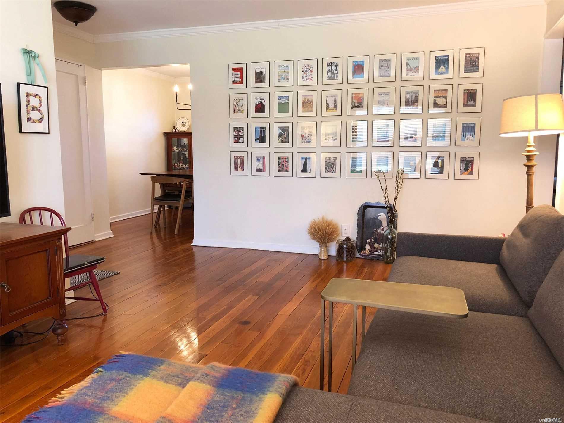 a work room with furniture and a book shelf