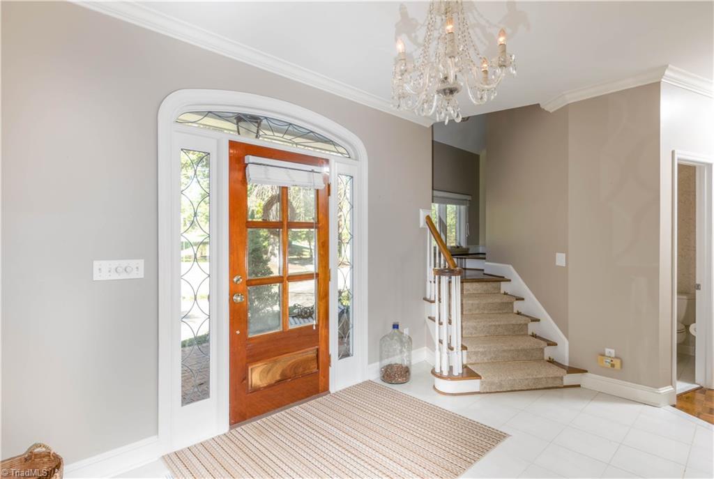 2012 River Road Stoneville, NC 27048 - Photo 9 of 30 Large foyer with beautifully designed front door and lake views as you walk right into the great room.