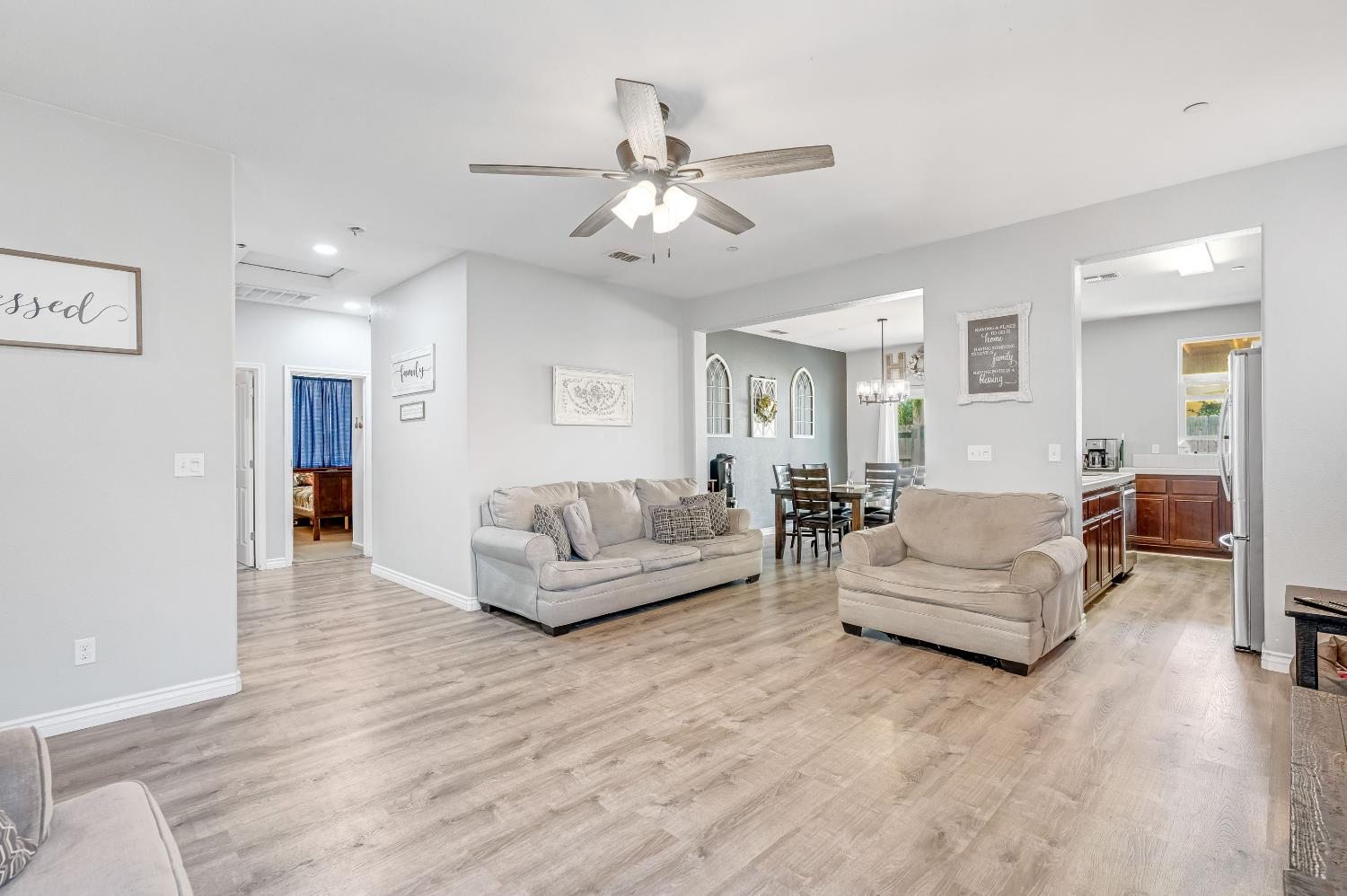 1981 Dunbar Way Dinuba, CA 93618 - Photo 3 of 12 a living room with furniture and a chandelier