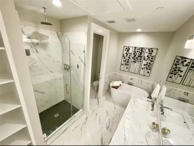 view of a bathroom with a tub shower and a sink