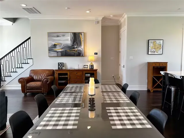 a bedroom with furniture and a rug