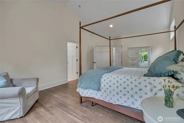 a bedroom with a bed and a couch