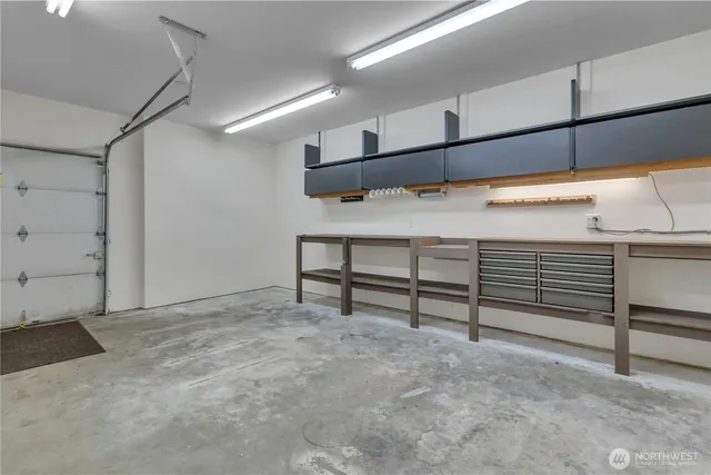 a view of an empty room with windows