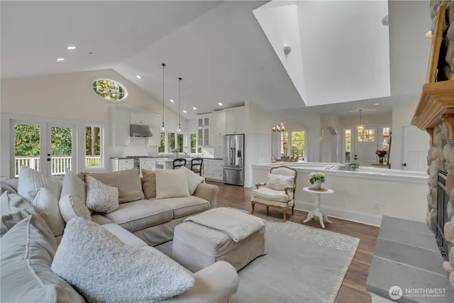 a living room with furniture and kitchen view