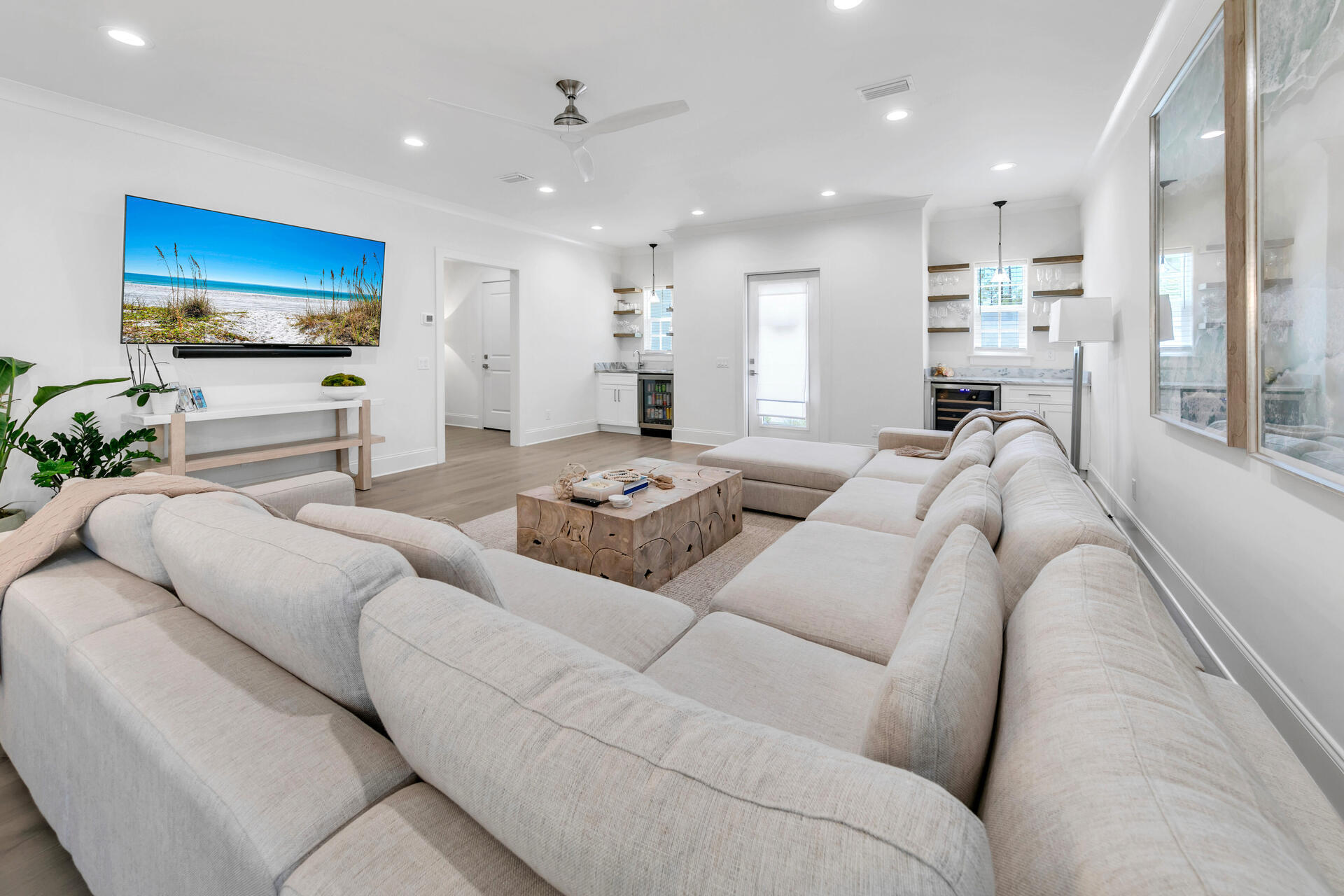 106 Heron's Crossing Santa Rosa Beach, FL 32459 - Photo 12 of 65 a living room with furniture kitchen view and a flat screen tv