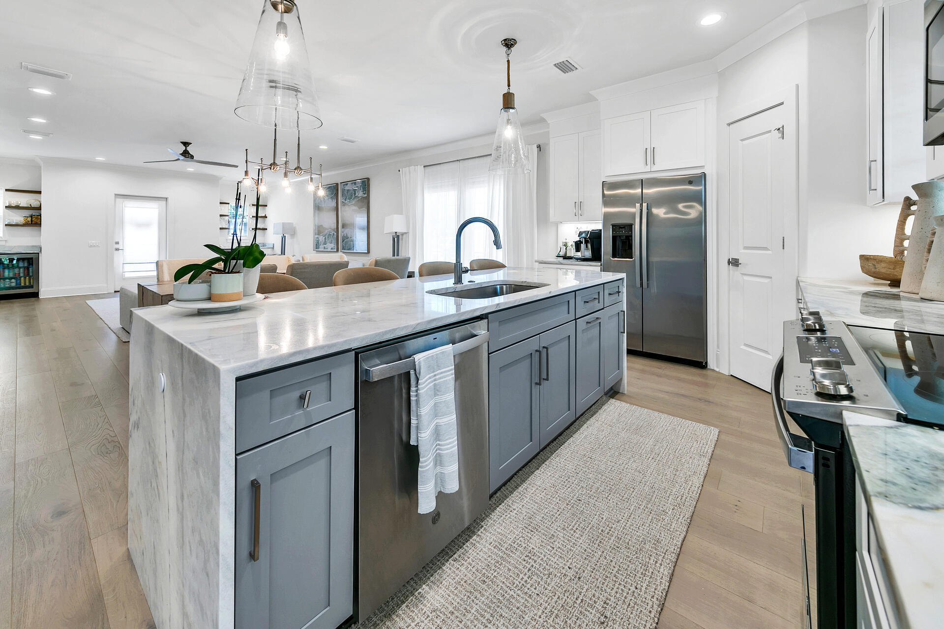 106 Heron's Crossing Santa Rosa Beach, FL 32459 - Photo 17 of 65 a kitchen with stainless steel appliances granite countertop a sink a stove and a refrigerator