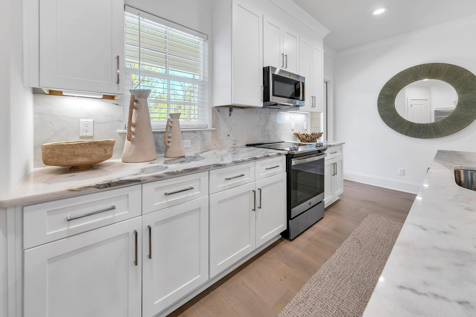 106 Heron's Crossing Santa Rosa Beach, FL 32459 - Photo 19 of 65 a kitchen with cabinets stainless steel appliances and a window