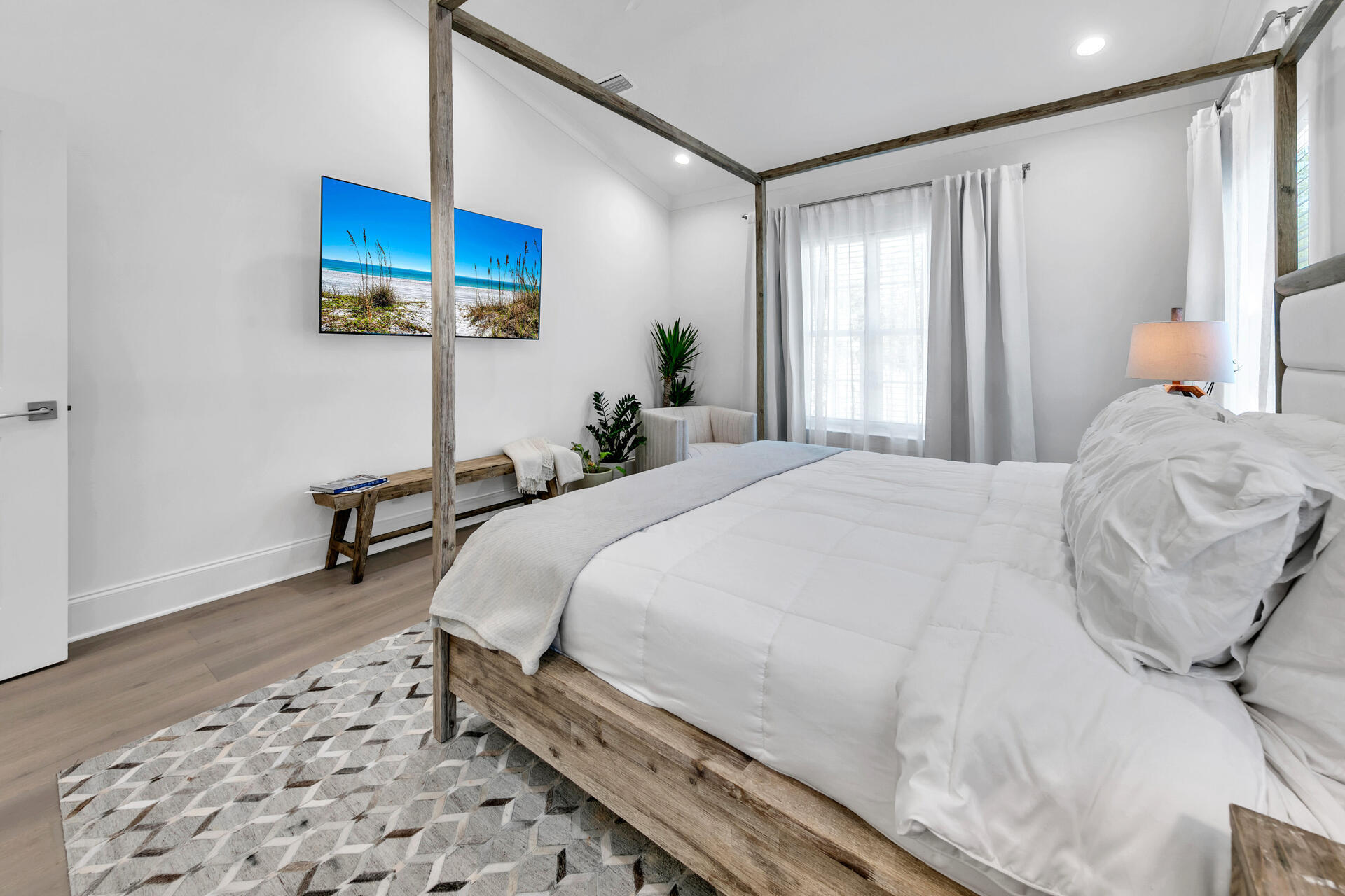 106 Heron's Crossing Santa Rosa Beach, FL 32459 - Photo 21 of 65 a large bedroom with a bed and wooden floor
