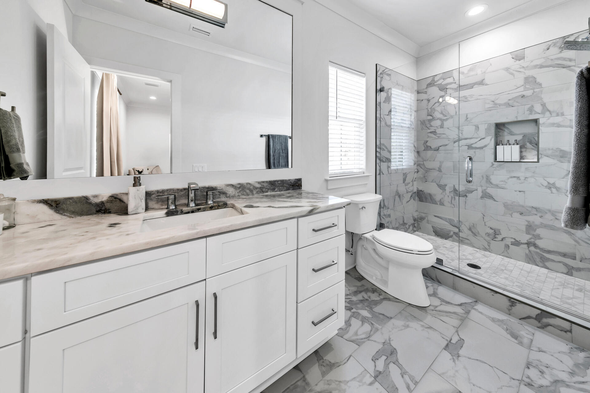 106 Heron's Crossing Santa Rosa Beach, FL 32459 - Photo 35 of 65 a spacious bathroom with a granite countertop sink toilet and shower