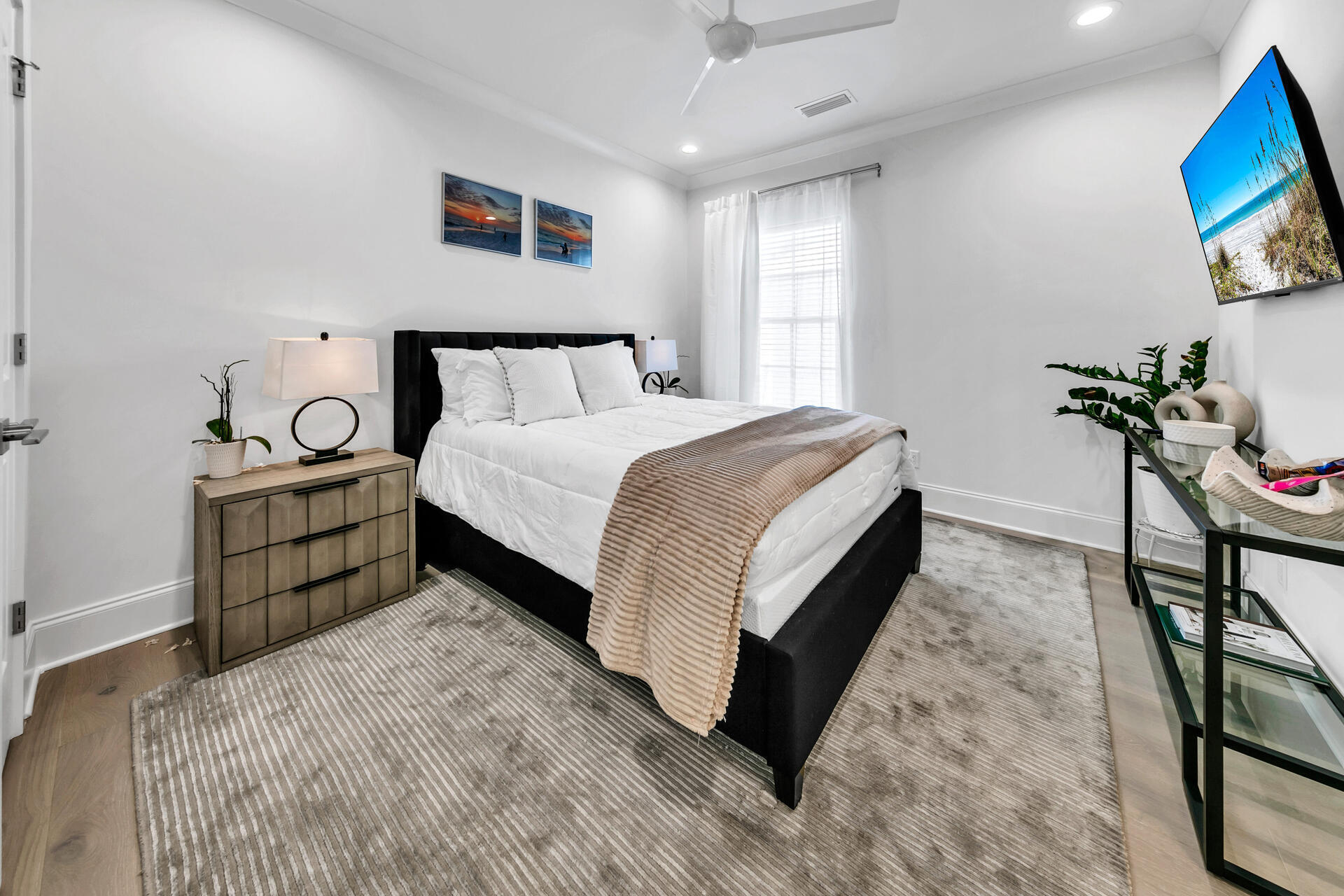 106 Heron's Crossing Santa Rosa Beach, FL 32459 - Photo 36 of 65 a spacious bedroom with a bed and a flat screen tv
