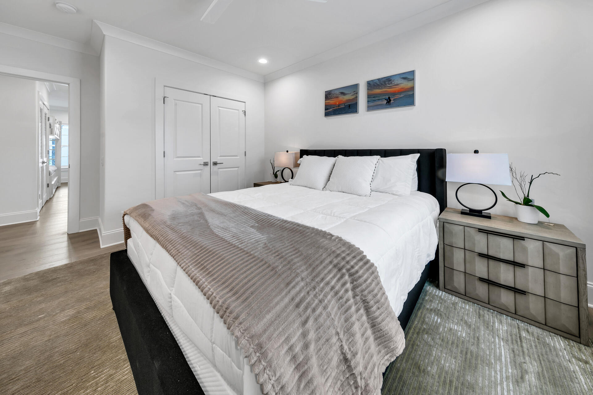 106 Heron's Crossing Santa Rosa Beach, FL 32459 - Photo 38 of 65 a spacious bedroom with a bed and wooden floor