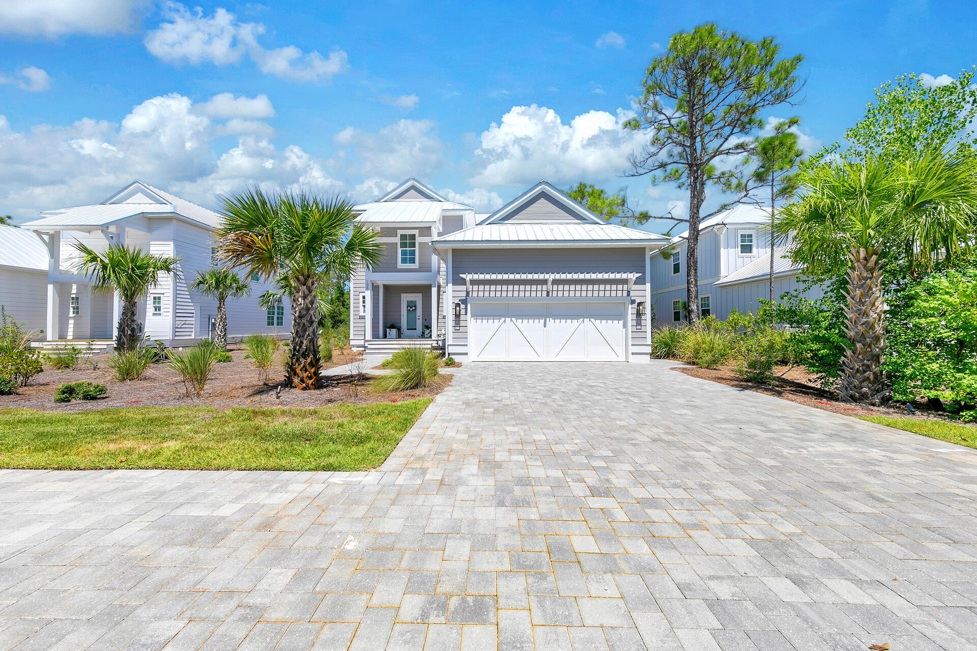 106 Heron's Crossing Santa Rosa Beach, FL 32459 - Photo 4 of 65 a front view of a house with garden