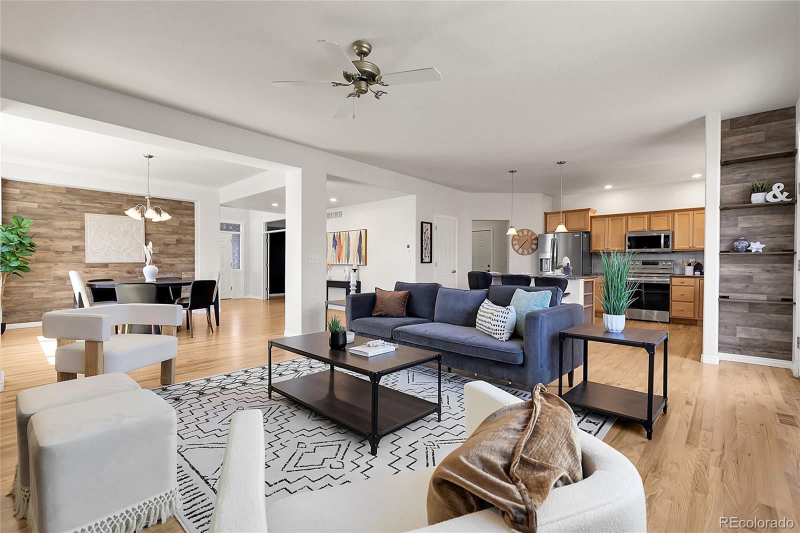 3406 Purcell Street Brighton, CO 80601 - Photo 11 of 50 a living room with furniture or kitchen view and a wooden floor