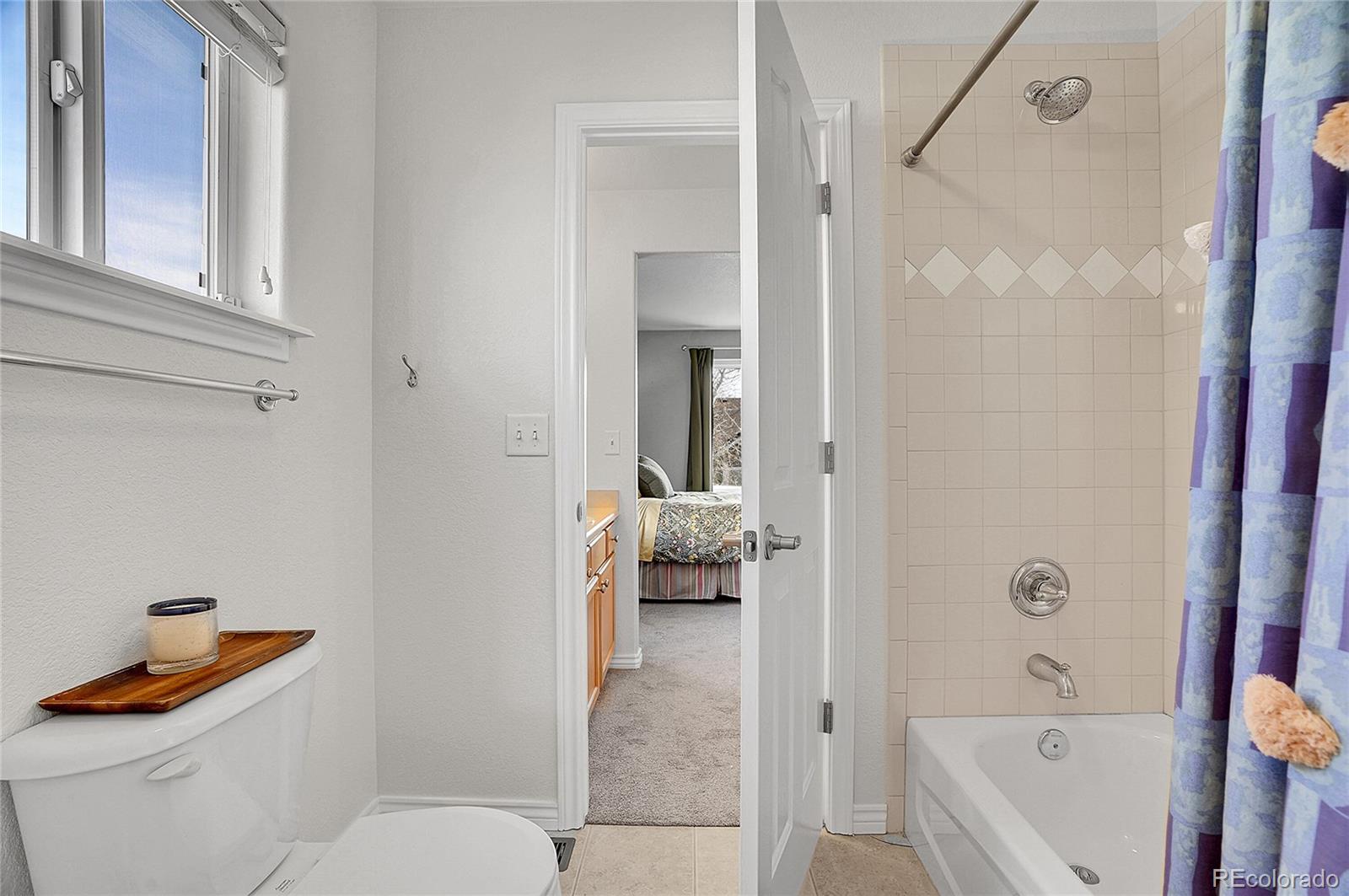 3406 Purcell Street Brighton, CO 80601 - Photo 28 of 50 a bathroom with a toilet and a shower