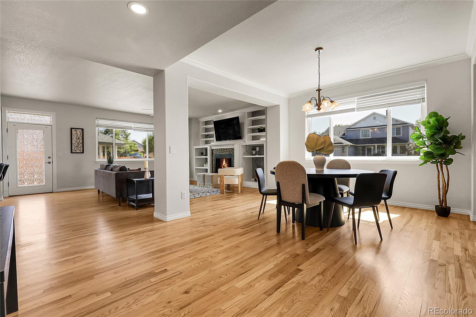 3406 Purcell Street Brighton, CO 80601 - Photo 7 of 50 a view of a dining room with furniture and wooden floor