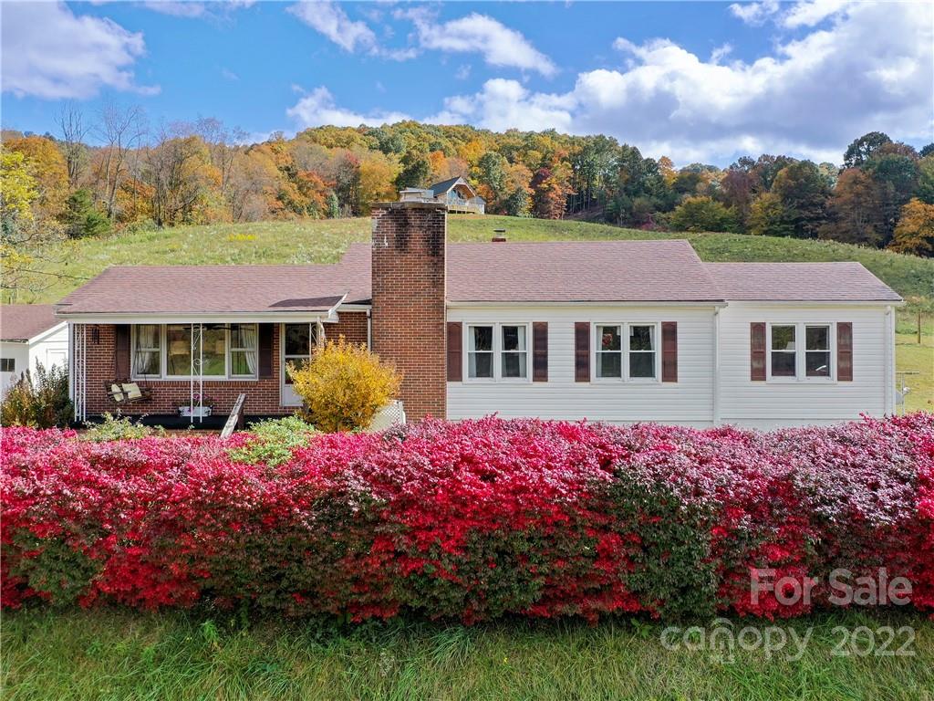 50 Farm House Road Canton, NC 28716 - Photo 1 of 29 a front view of a house with a garden