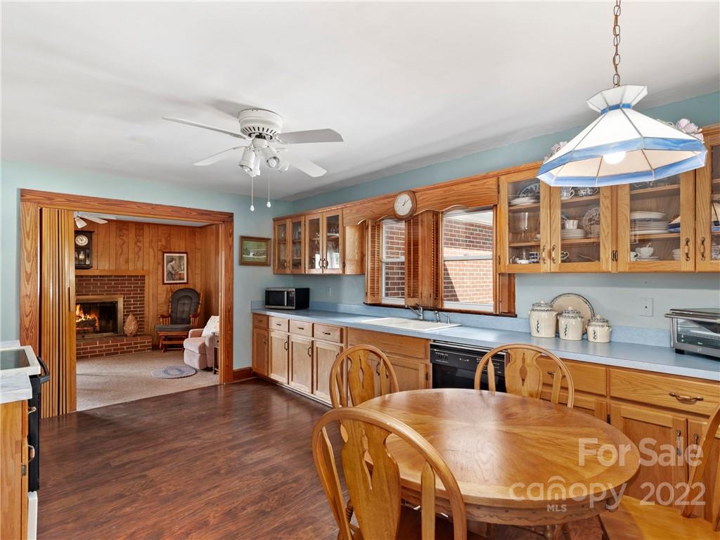 50 Farm House Road Canton, NC 28716 - Photo 11 of 29 a view of a dining room with furniture window and wooden floor