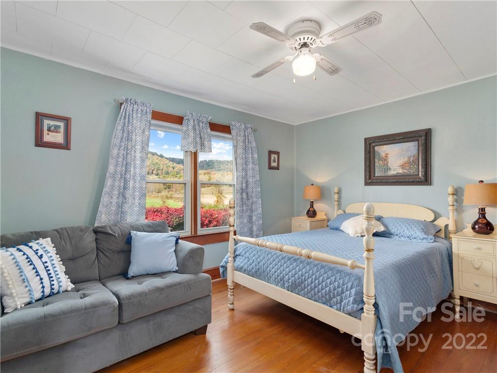 50 Farm House Road Canton, NC 28716 - Photo 16 of 29 a bedroom with a bed couch and window