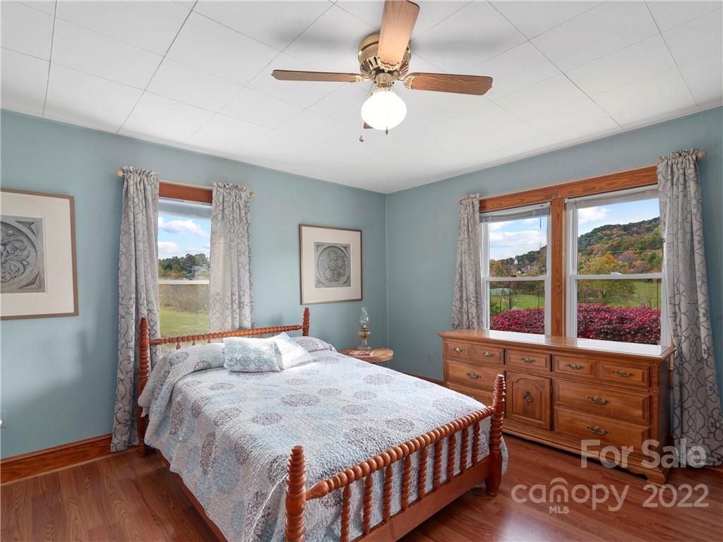 50 Farm House Road Canton, NC 28716 - Photo 19 of 29 a bedroom with a large bed and a window
