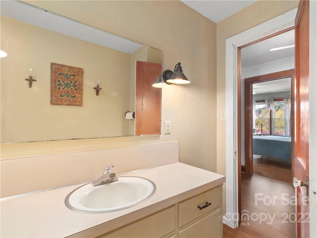 50 Farm House Road Canton, NC 28716 - Photo 22 of 29 a bathroom with a sink and a mirror