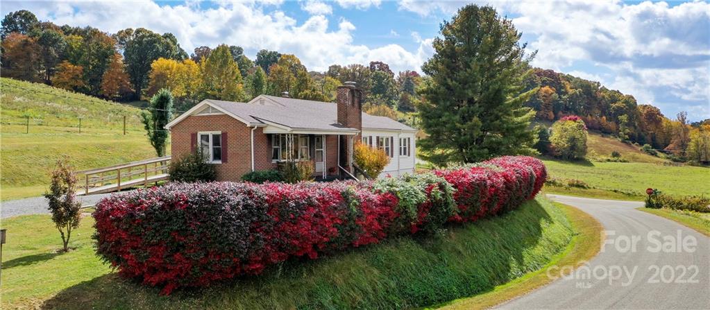 50 Farm House Road Canton, NC 28716 - Photo 28 of 29 a front view of a house with garden