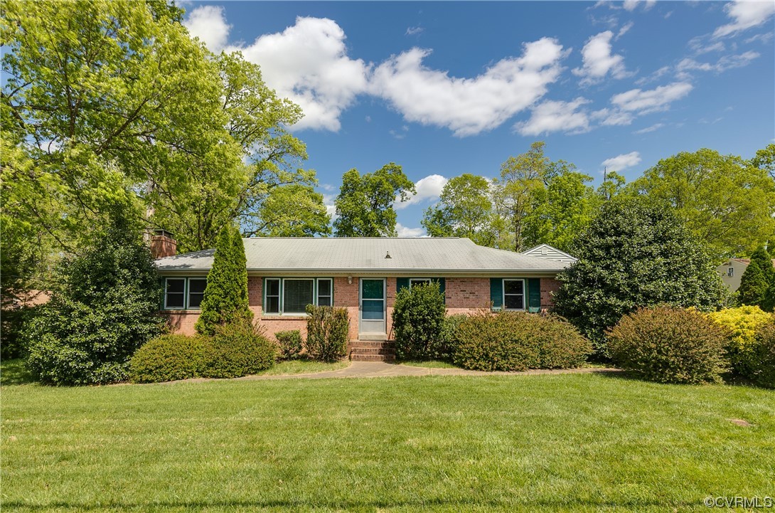 11606 Genito Road Midlothian, VA 23112 - Photo 2 of 48 a front view of a house with garden