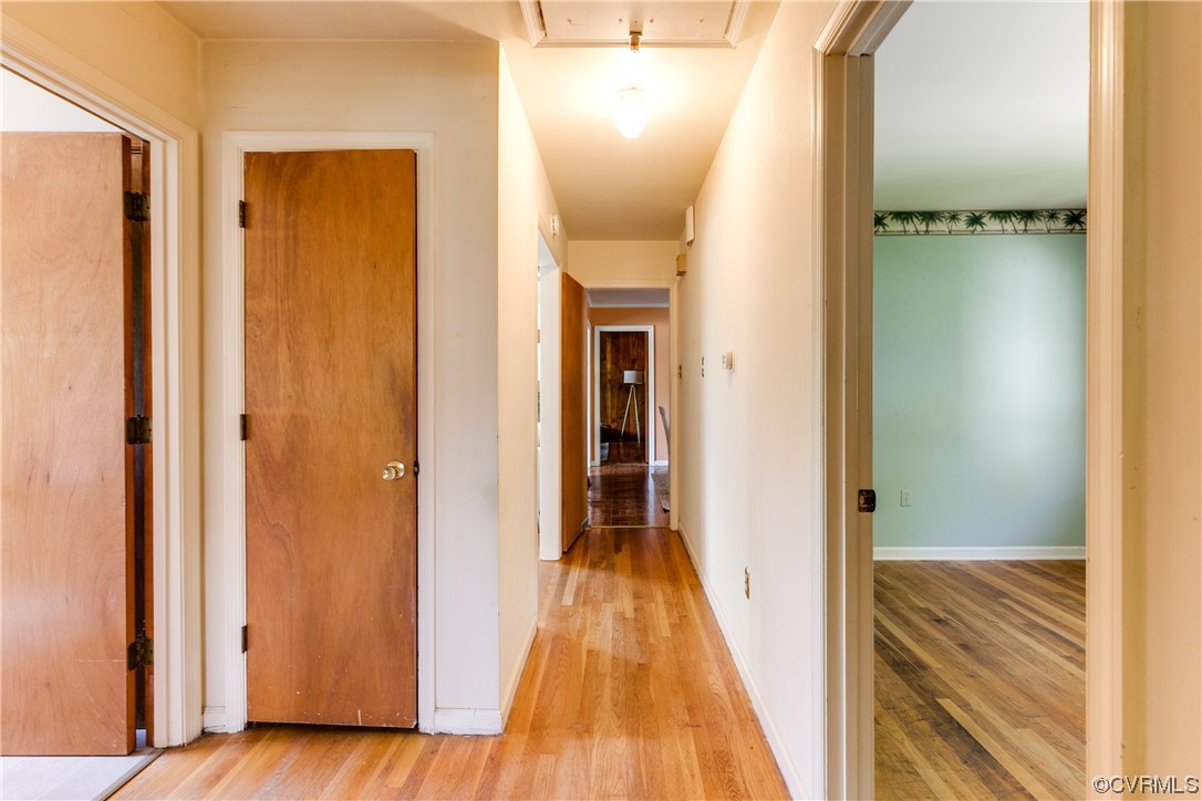 11606 Genito Road Midlothian, VA 23112 - Photo 26 of 48 a view of a hallway with wooden floor and staircase