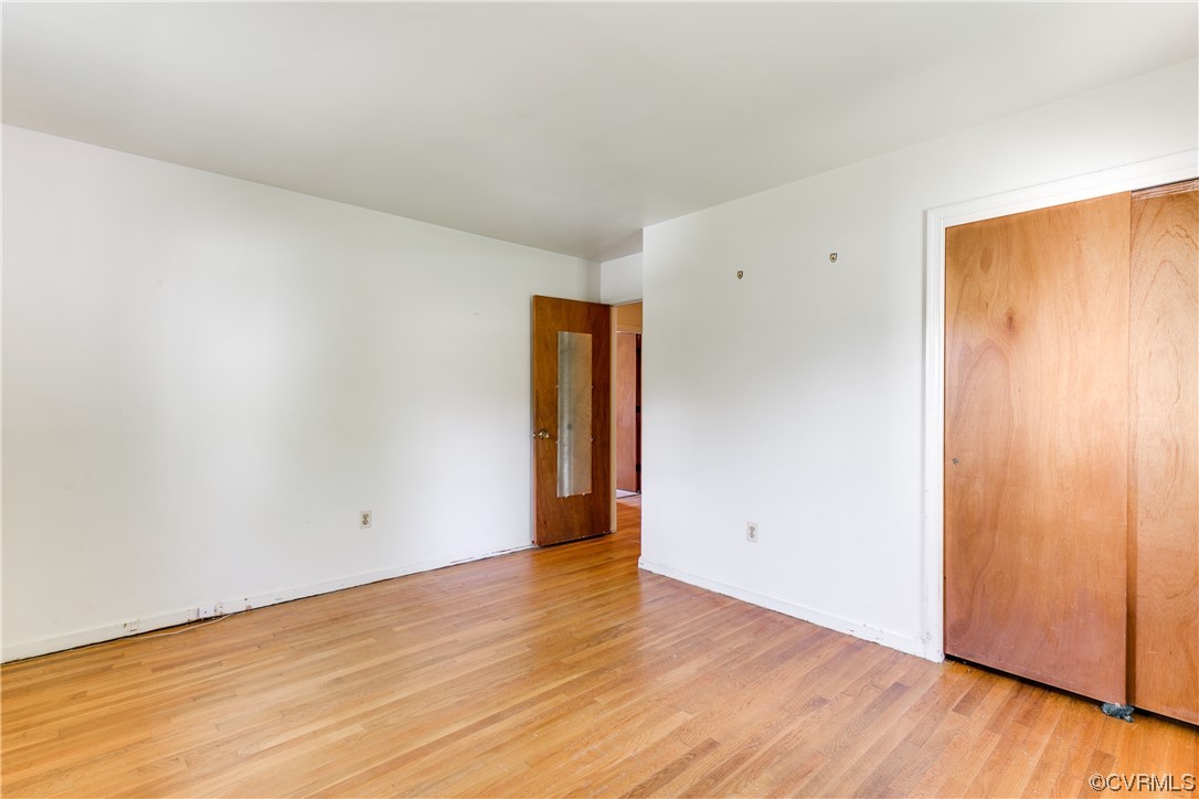 11606 Genito Road Midlothian, VA 23112 - Photo 37 of 48 a view of an empty room with wooden floor