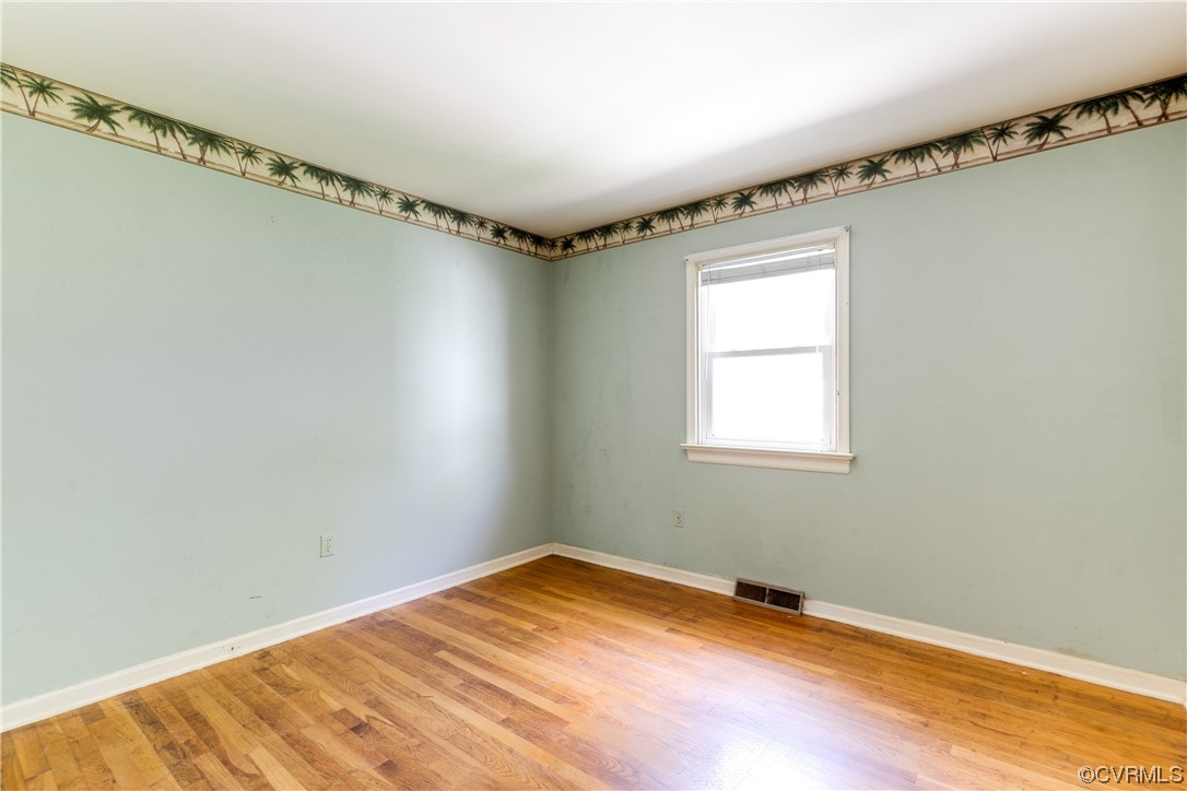 11606 Genito Road Midlothian, VA 23112 - Photo 38 of 48 a view of a room with wooden floor and windows