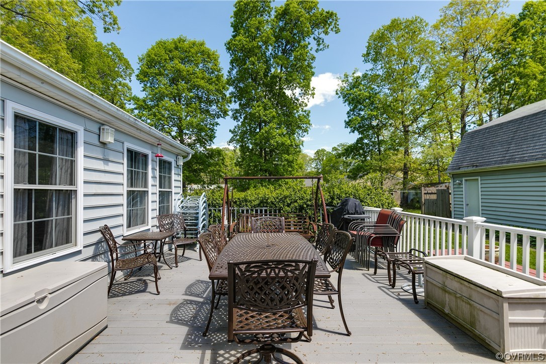 11606 Genito Road Midlothian, VA 23112 - Photo 41 of 48 a view of a patio with a table and chairs