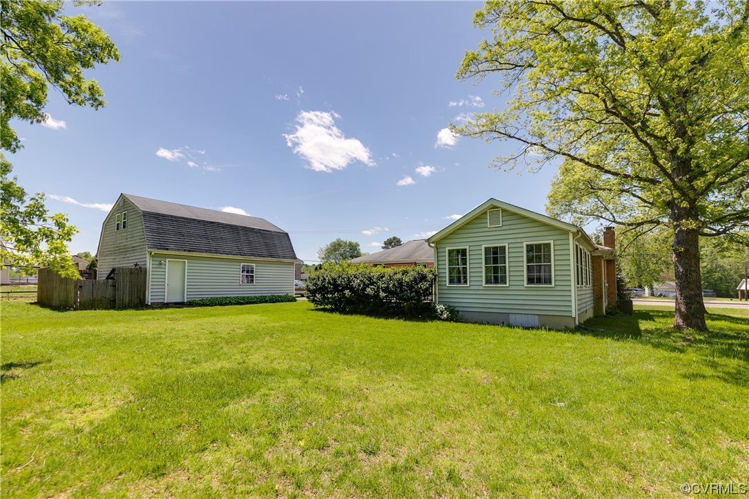 11606 Genito Road Midlothian, VA 23112 - Photo 46 of 48 a front view of a house with a yard and trees
