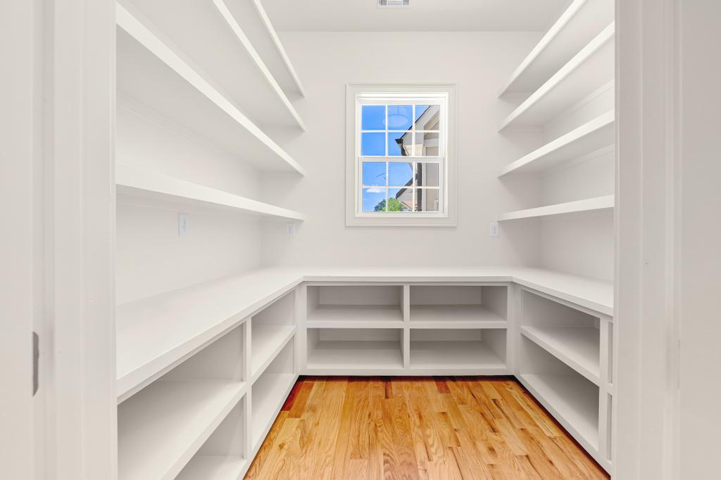 707 Vickery Street Extension Hartwell, GA 30643 - Photo 11 of 50 Ample built-in shelving and hardwood floors create a highly organized pantry with natural light.
