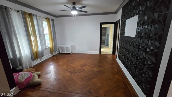 wooden floor in an empty room with a fireplace