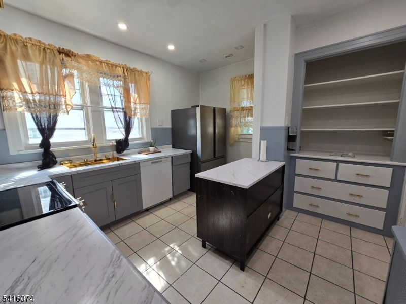 170 Spring Street Passaic, NJ 07055 - Photo 10 of 16 a kitchen with a cabinets and counter space